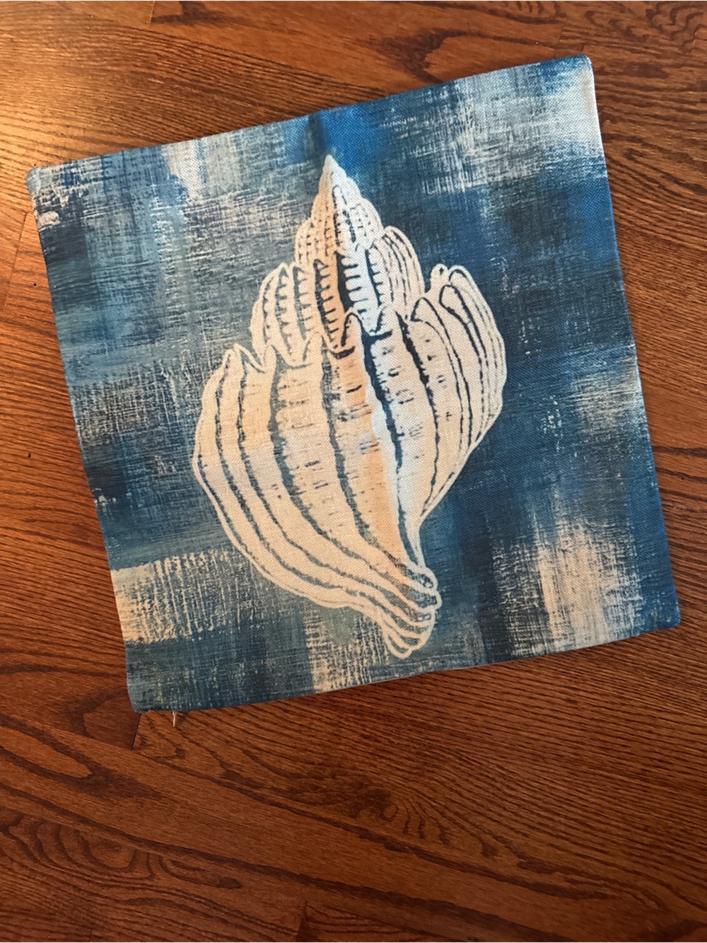Nautical Blue Shell Print pillow cover on teal-blue background 18x18
